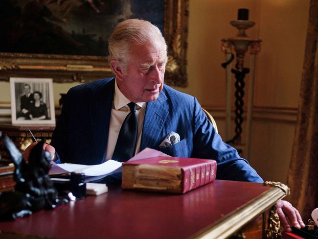 A Buckingham Palace handout image released on September 23, 2022, shows King Charles III carrying out official government duties from his red box in the Eighteenth Century Room at Buckingham Palace, London on September 11, 2022. (Photo by Victoria Jones / BUCKINGHAM PALACE / AFP) / RESTRICTED TO EDITORIAL USE - MANDATORY CREDIT "AFP PHOTO / VICTORIA JONES / BUCKINGHAM PALACE " - NO MARKETING - NO ADVERTISING CAMPAIGNS - NO DIGITAL ALTERATION ALLOWED  - DISTRIBUTED AS A SERVICE TO CLIENTS - NOT TO BE USED AFTER OCTOBER 7 2022 / EDITORS NOTE: PLEASE NOTE THE DOCUMENTS IN THE IMAGE HAVE BEEN BLURRED