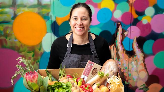 Sparkke at The Whitmore head chef Emma McCaskill with a market produce box. Picture: SUPPLIED