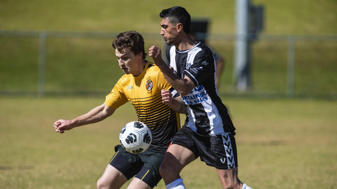 Joshua Allen (left) of Dalby Tigers and Majeed Sulaiman of Willowburn in Div 2 Men FQ Darling Downs Presidents Cup football at West Wanderers, Sunday, July 24, 2022. Picture: Kevin Farmer