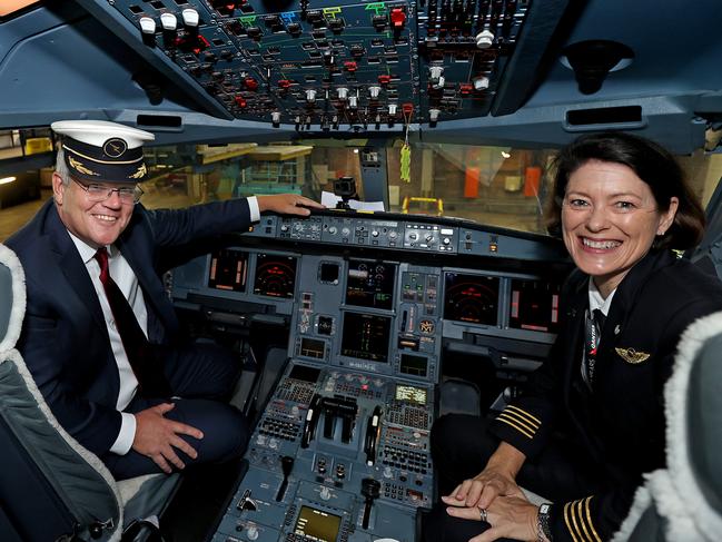 SYDNEY, AUSTRALIA - NewsWire Photos MARCH 11, 2021: Pictured is Australian Prime Minister Scott Morrison and Qantas Pilot Captain Debbie Slade in the cockpit of an Airbus A330 at Qantas Hangar 96 at Sydney Airport in Sydney NSW. Picture: NCA NewsWire - POOL / Dylan Coker