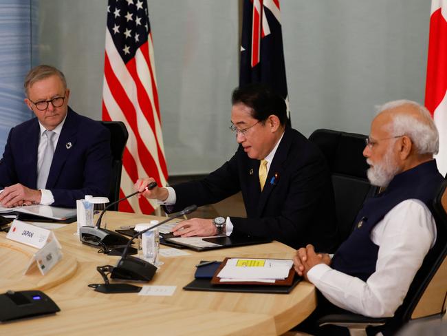 Australia's Prime Minister Anthony Albanese (L), Japan's Prime Minister Fumio Kishida (C), India's Prime Minister Narendra Modi, and US President Joe Biden (not pictured) hold a quad meeting on the sidelines of the G7 Leaders' Summit in Hiroshima on May 20, 2023. (Photo by JONATHAN ERNST / POOL / AFP)