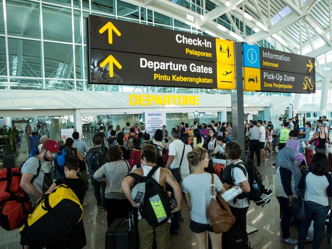 DENPASAR, BALI, INDONESIA - JULY 13:  Foreign tourists arrive at Ngurah Rai International airport departure on July 13, 2015 in Denpasar, Bali, Indonesia. Bali's international airport reopened after being closed due to volcanic ash clouds from Maunt Raung, but Australia's main carriers to the holiday destinations are still not flying. (Photo by Agung Parameswara/Getty Images)