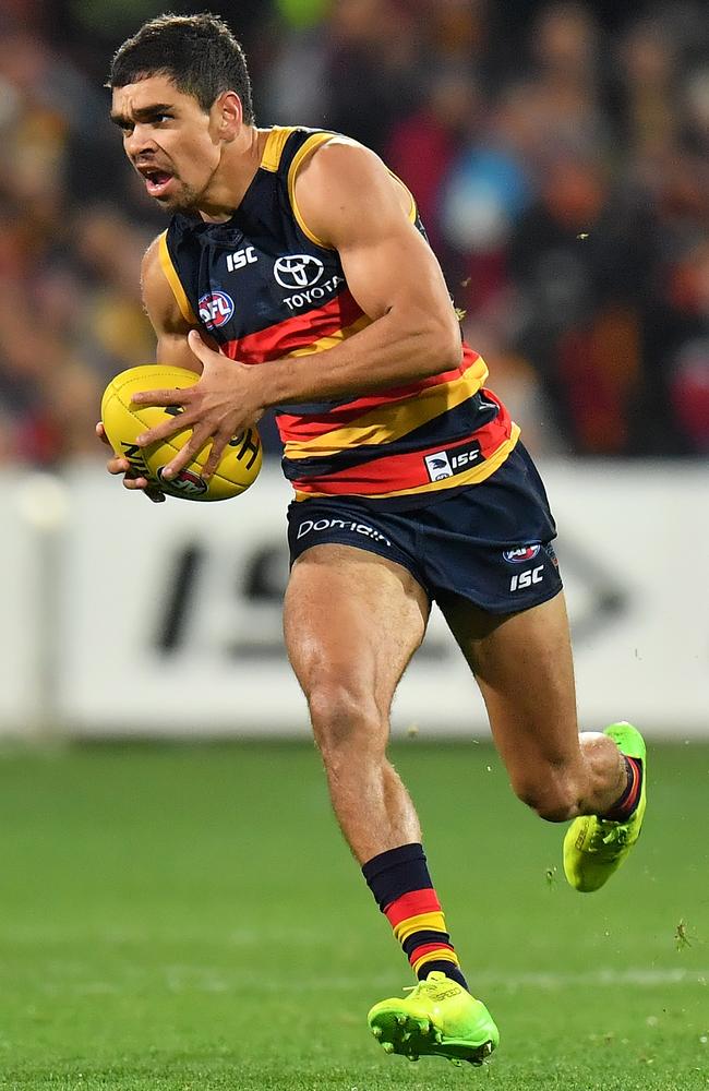 Charlie Cameron of the Crows runs with the ball against St Kilda Saints at Adelaide Oval.