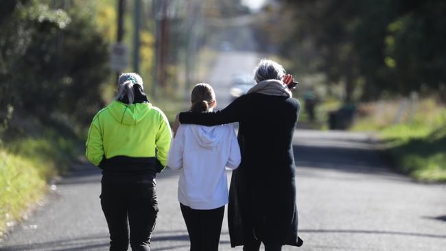 Locals leave the scene of a fatal crash after paying their respect. Picture: John Grainger/Daily Telegraph