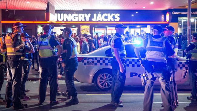 Police called to a massive brawl at Federation Square were out-numbered by rioters. Picture: Jake Nowakowski