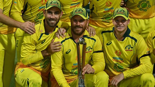 Glen Maxwell, captain Adam Finch and Steve Smith with the Chappell-Hadlee Trophy. Picture: Emily Barker/Getty Images