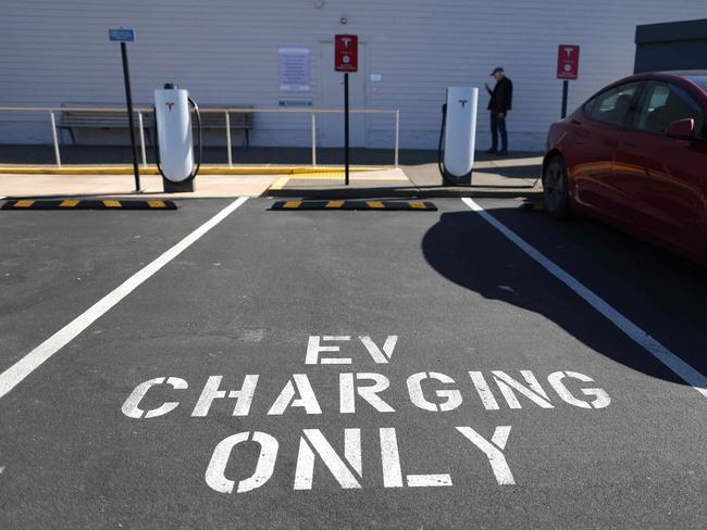 CORTE MADERA, CALIFORNIA - FEBRUARY 15: A Tesla Supercharger station sits empty on February 15, 2023 in Corte Madera, California. Electric car company Tesla is partnering with the U.S. federal government to expand electric vehicle charging infrastructure in the United States. Tesla announced plans to open an estimated 7,500 of its Tesla Superchargers in the country to all brands of electric vehicles by the end of 2024.   Justin Sullivan/Getty Images/AFP (Photo by JUSTIN SULLIVAN / GETTY IMAGES NORTH AMERICA / Getty Images via AFP)