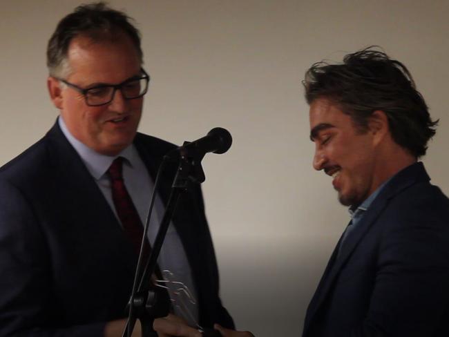 John Ibrahim presents the 2018 Dangar prize for best crime book, film or podcast to The Australian journalist Hedley Thomas.