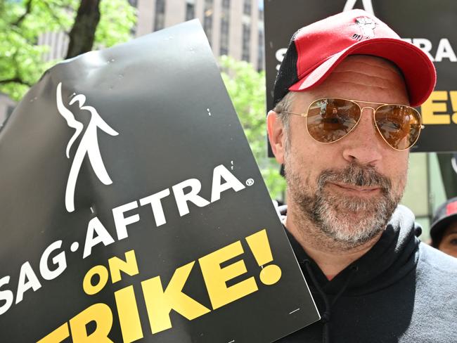 Jason Sudeikis joins members of the Writers Guild of America and the Screen Actors Guild as they walk a picket line outside NBC Universal in New York City. Picture: AFP