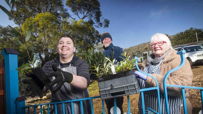 Understory Nursery volunteers Daniel Page and Leah McDougall with manager Mark Blaxall getting ready for their plant sale on August 29th. Picture: LUKE BOWDEN