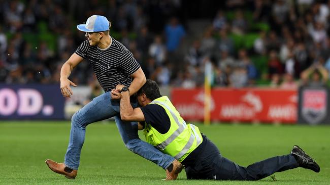 The pitch invasion was described by some as Australian football’s darkest day. Picture: Tracey Nearmy.