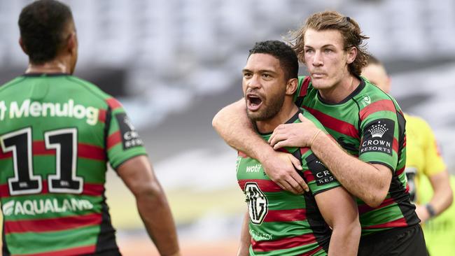 SYDNEY, AUSTRALIA – MAY 13: Taane Milne of the Rabbitohs celebrates scoring a try with teammates during the round 11 NRL match between South Sydney Rabbitohs and Wests Tigers at Accor Stadium on May 13, 2023 in Sydney, Australia. (Photo by Brett Hemmings/Getty Images)