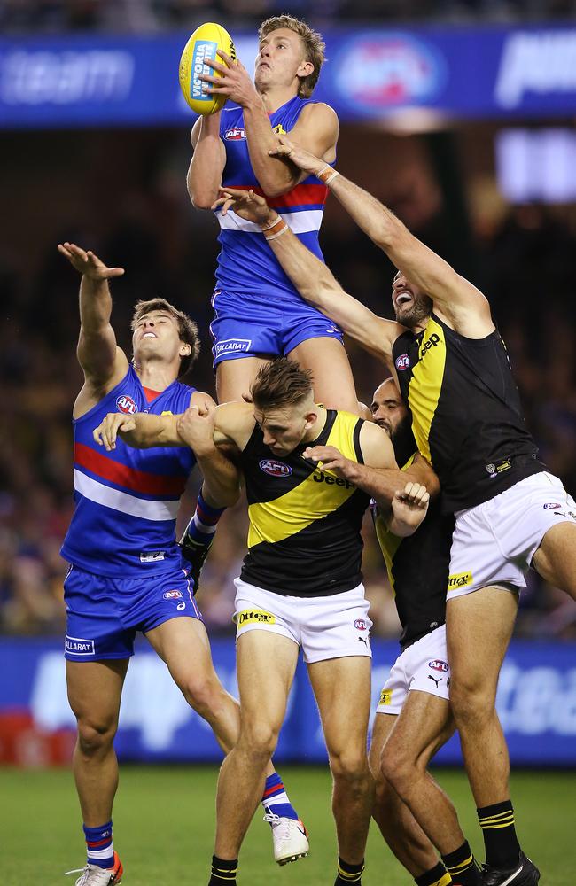 Aaron Naughton climbs for a hanger during his dominant performance against Richmond. Picture: Michael Dodge/Getty Images. 