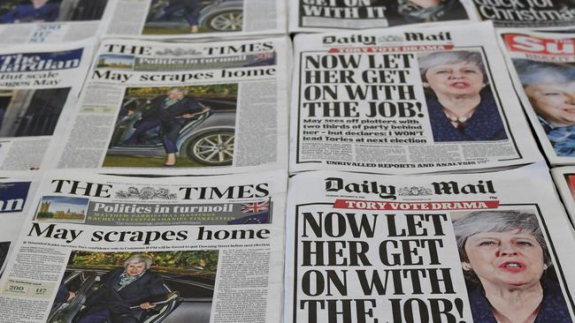 British newspaper coverage of May’s narrow retention of the leadership. Picture: Daniel Sorabji/AFP