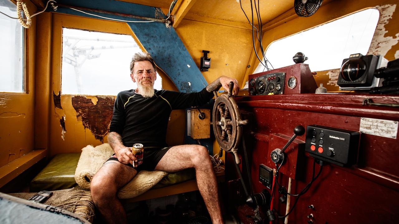 Tony Higgins behind the wheel of his vessel Margrel. Picture: Matt Turner