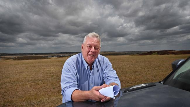 John Wagner, holding site plans, on the area at his Wellcamp airport where he wants to immediately build a covid quarantine facility, at Toowoomba, west of Brisbane. Picture: Lyndon Mechielsen/ The Australian