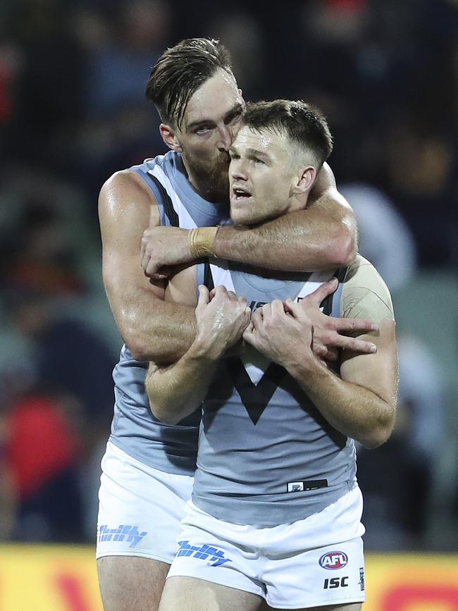 Charlie Dixon plants a kiss on Power teammate Robbie Gray after Saturday’s Showdown win. Picture: Sarah Reed