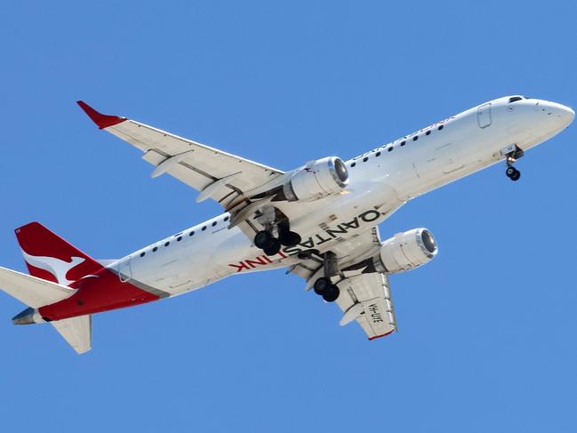 BRISBANE, AUSTRALIA - NewsWire Photos SEPTEMBER 30, 2024: A Qantas plane prepares to land in Brisbane. Hundreds of Qantas workers went on strike today demanding higher wages. Picture: NewsWire/Tertius Pickard