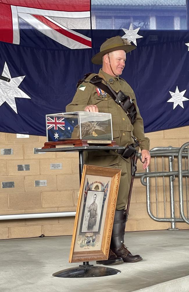 John McGill with the slouch hat of his late uncle Allan McGill and a print of his grandfather Jack McGill donated to the Kuttabul RSL sub branch by Christine McGill as per Allan's wishes. Kuttabul Dawn Service at Hampden State School. Picture: Janessa Ekert