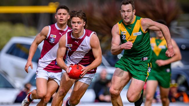 Traralgon's Marlon Neocleous is chased down by Leongatha's Tom Marriott in the grand final. Warren ‘Wazshots’ Leyden