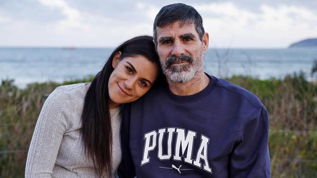 Chris Herbert at Umina with his daughter Emma, recollecting a horrific kite surfing accident. Picture: Sam Ruttyn