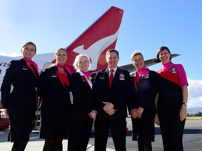 Qantas cabin crew members pose for a photograph at Adelaide Airport in Adelaide, Wednesday, May 8, 2019.