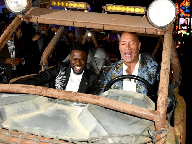 Kevin Hart and Dwayne Johnson messing around in a dune buggy at the LA premier in December. Picture: Kevin Winter/Getty Images/AFP