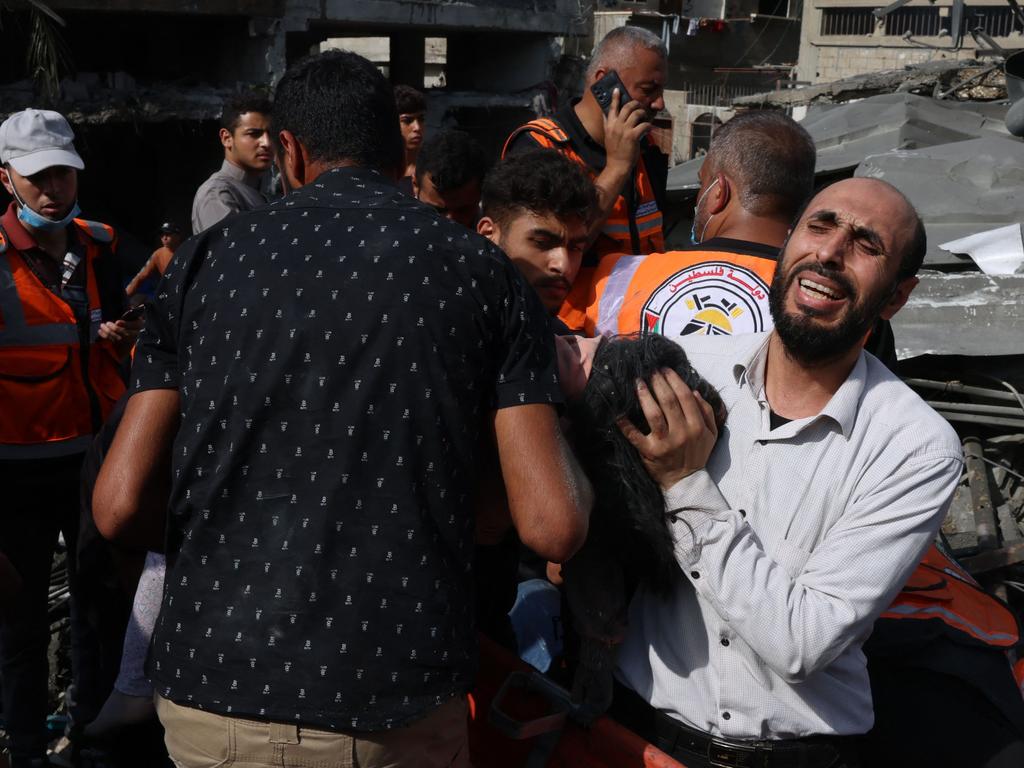 A Palestinian man reacts as the body of his daughter is unearthed from under the rubble after an Israeli strike on Rafah in the southern Gaza Strip. Picture: AFP