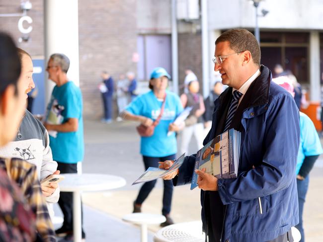 Liberal Julian Leeser hands out how to vote cards at early voting in the seat of Berowra at Hornsby TAFE. Picture: NewsWire / Damian Shaw