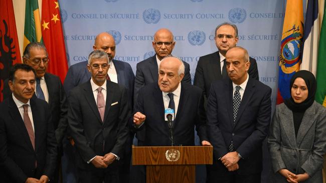 Palestinian Ambassador to the United Nations Riyad Mansour, flanked by representatives of Arab countries, speaks to the press after a UN General Assembly meeting.