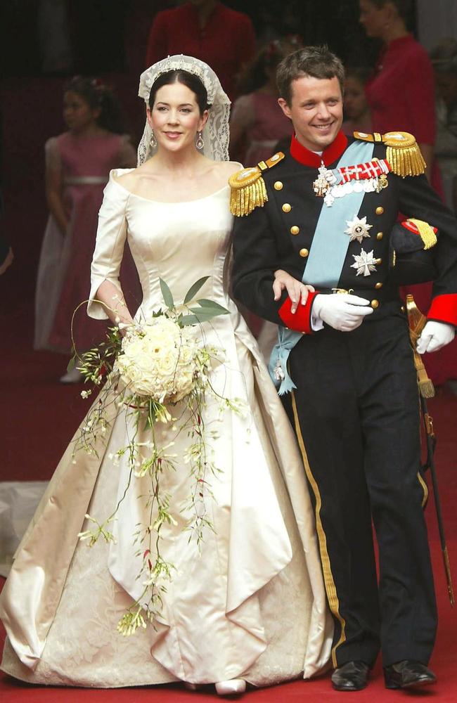 The much-replicated ivory gown featured an off-the-shoulder neckline and three-quarter sleeves. Picture: AFP