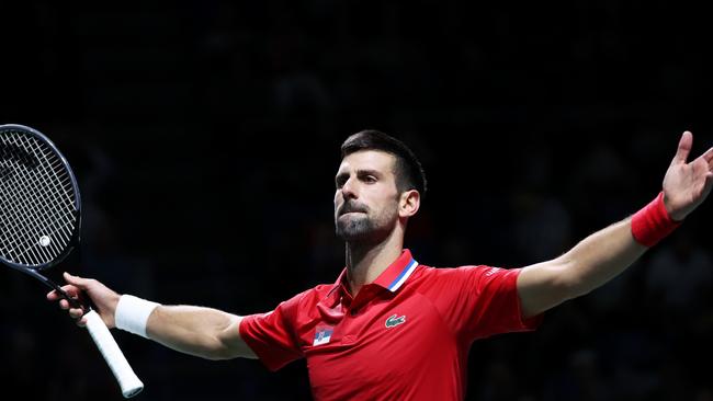 MALAGA, SPAIN - NOVEMBER 23: Novak Djokovic of Serbia celebrates winning match point during the Quarter-Final match against Cameron Norrie of Great Britain in the Davis Cup Final at Palacio de Deportes Jose Maria Martin Carpena on November 23, 2023 in Malaga, Spain. (Photo by Clive Brunskill/Getty Images for ITF)