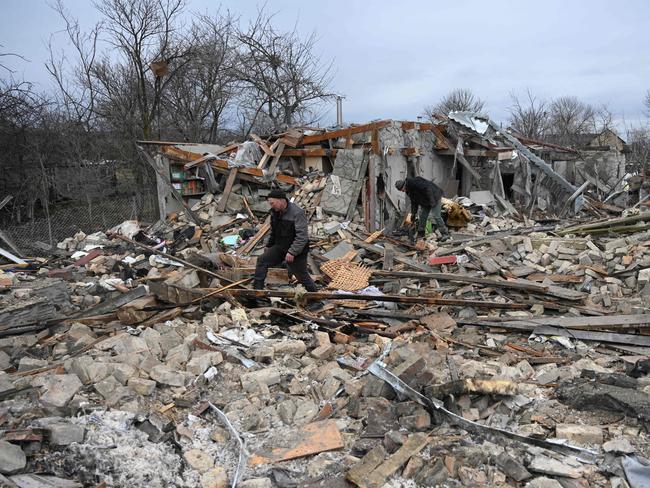 People search the rubble of a house following a Russian strike in the village of Velyka Vilshanytsia, some 50km from Lviv. Picture: AFP