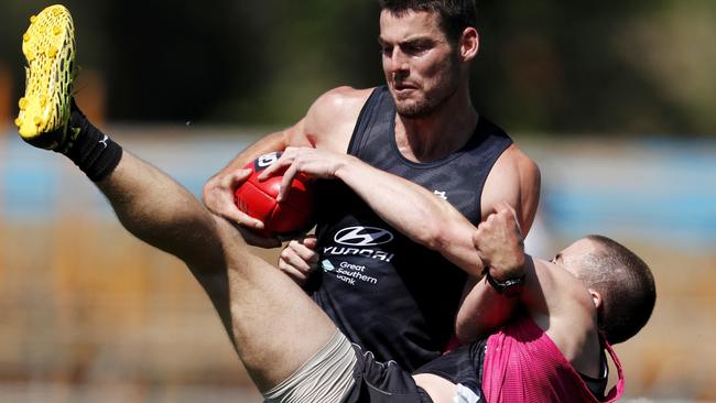 George Hewett is tackled by Matthew Owies. Picture: AFL Photos via Getty Images