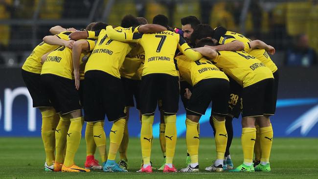 The Dortmund players huddle prior to the UEFA Champions League Quarter Final first leg.