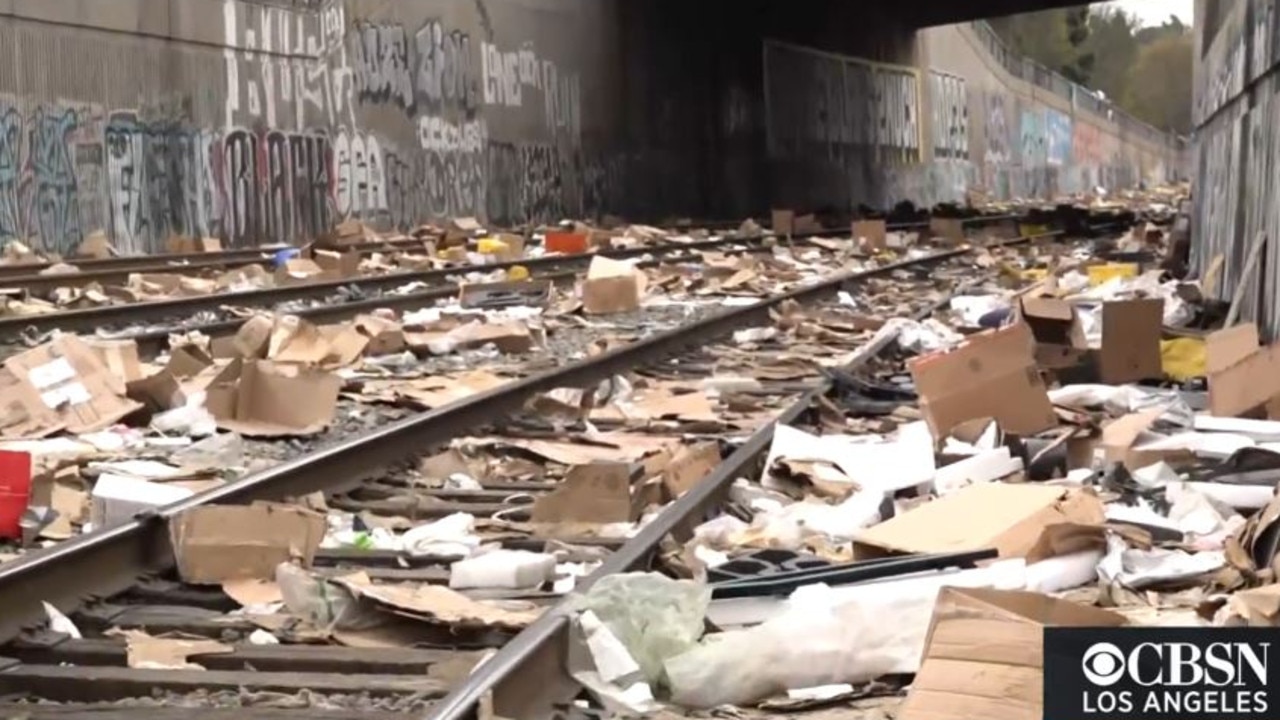 Packages and debris litter train tracks in Los Angeles.