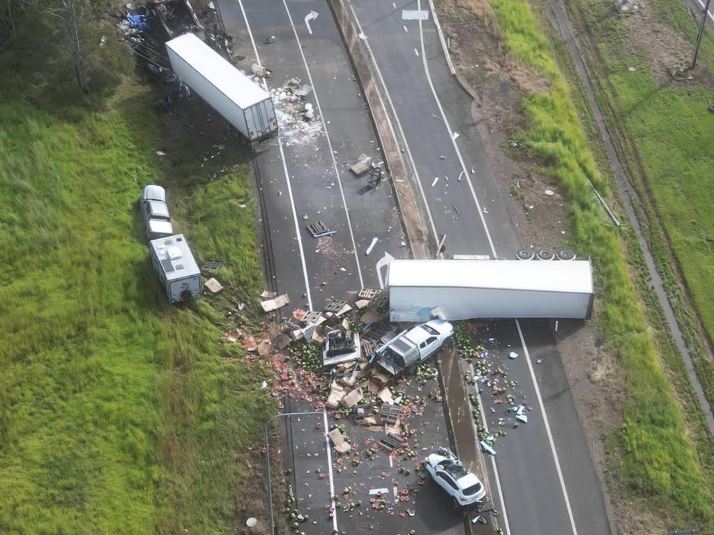 An aerial photo shows the devastating scene in which at least three people have died in a five vehicle crash on the Bruce Highway near Maryborough. Photo: Michael O'connor