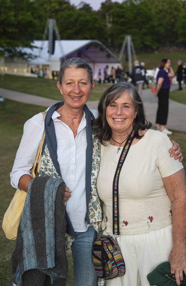 Eva Schmidt (left) and Maree Rosier at the Symphony Under the Stars concert performed by the Queensland Symphony Orchestra in Queens Park Amphitheatre for Carnival of Flowers, Friday, October 4, 2024. Picture: Kevin Farmer