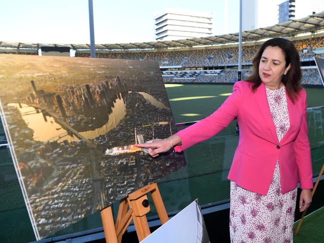 Premier Annastacia Palaszczuk looks at artist impressions of a proposed redevelopment at the Gabba in Brisbane. Picture: NCA NewsWire / Dan Peled