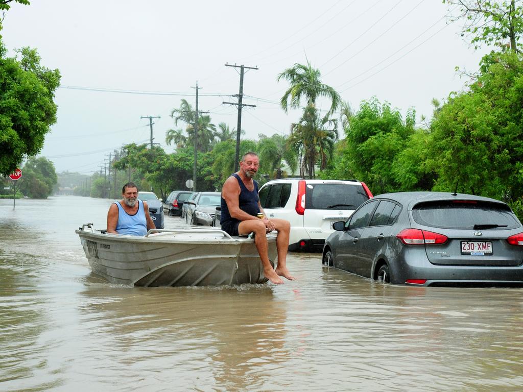 A boat goes down Carr Street, Hermit Park. Picture: Evan Morgan