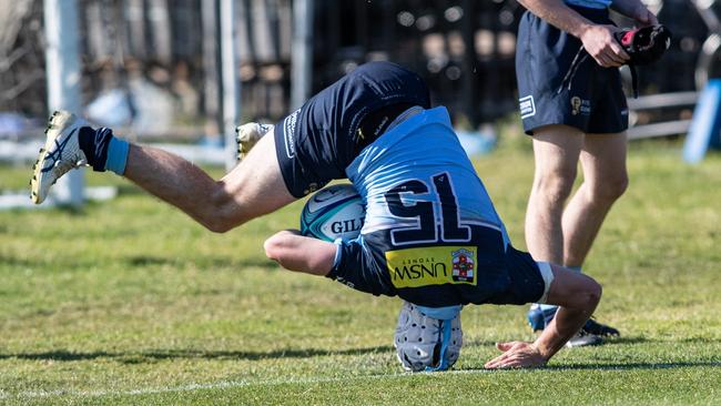 Angus Staniforth turning the game on its head. Pics: Julian Andrews