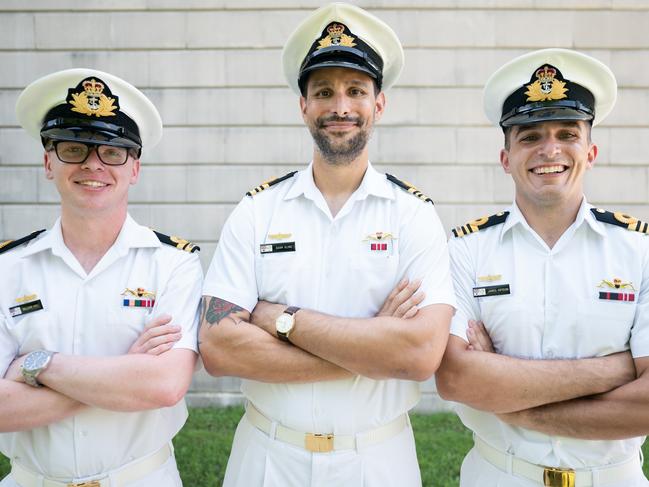 Lt. William Hall, left, Lt. Cmdr. Adam Klyne and Lt. Cmdr. James Heydon pose for a photo after a Naval Nuclear Power Training Command graduation ceremony at Joint Base Charleston in Goose Creek, South Carolina. Picture: Sean Rayford for The Daily Telegraph