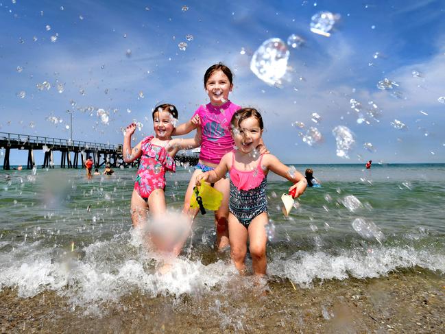 HOLDING FOR THURSDAY PAPER .  HOT WEATHER. HENLEY BEACH. Sisters Quinn 5, Ellliot 8 and Darcy 3 cool off at Henley Beach as the heat starts to escalate. Picture: Tricia Watkinson(**mum Tara 0431179550, they are locals)