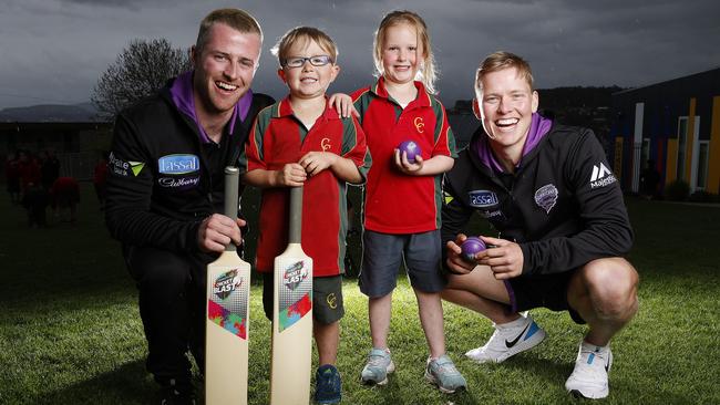 The Hobart Hurricanes players Mac Wright and Nathan Ellis with students from Corpus Christi Catholic School Huey Brasnja, 6 and Halle Steele, 6. Picture: Zak Simmonds