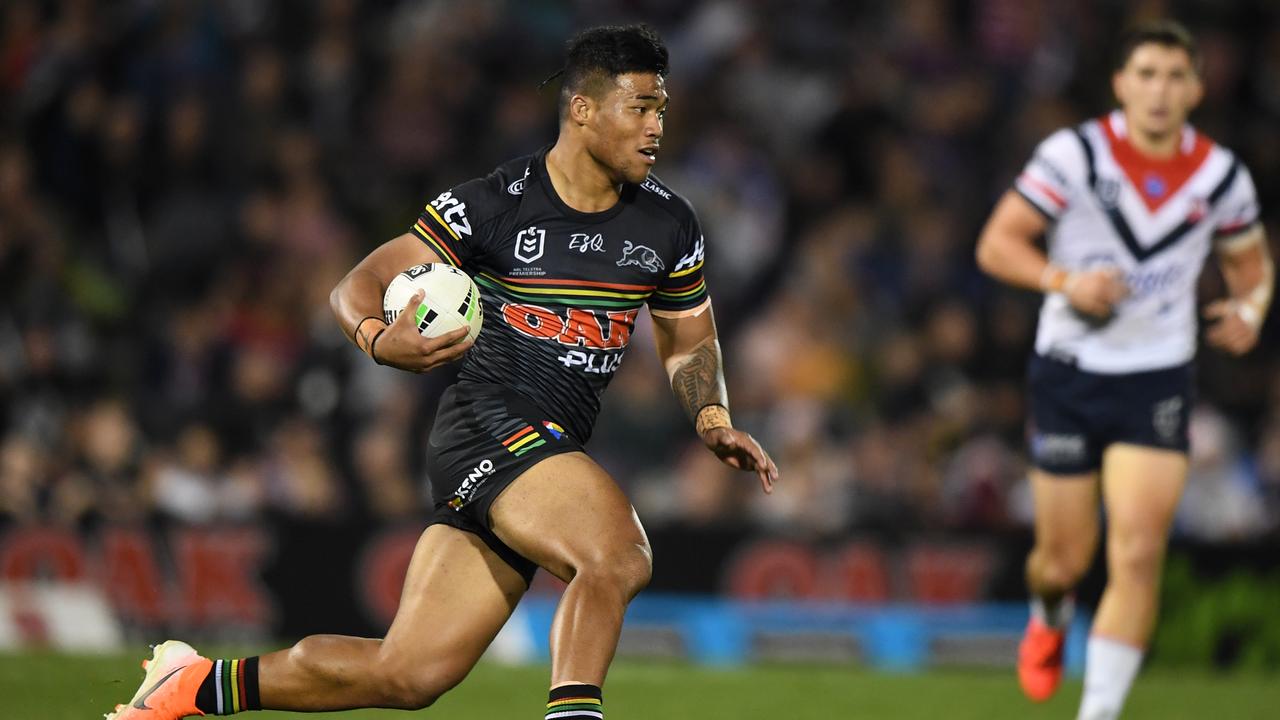 Brian To'o of the Panthers runs against the Roosters