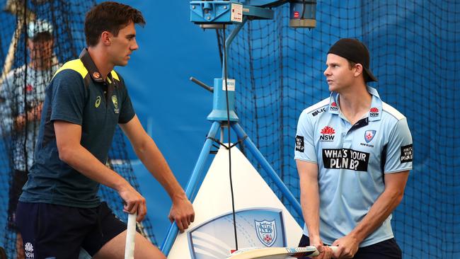 Former Australia teammates Pat Cummins (L) and Steve Smith. Picture: Getty