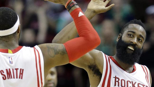 Houston Rockets' James Harden celebrates with Josh Smith.