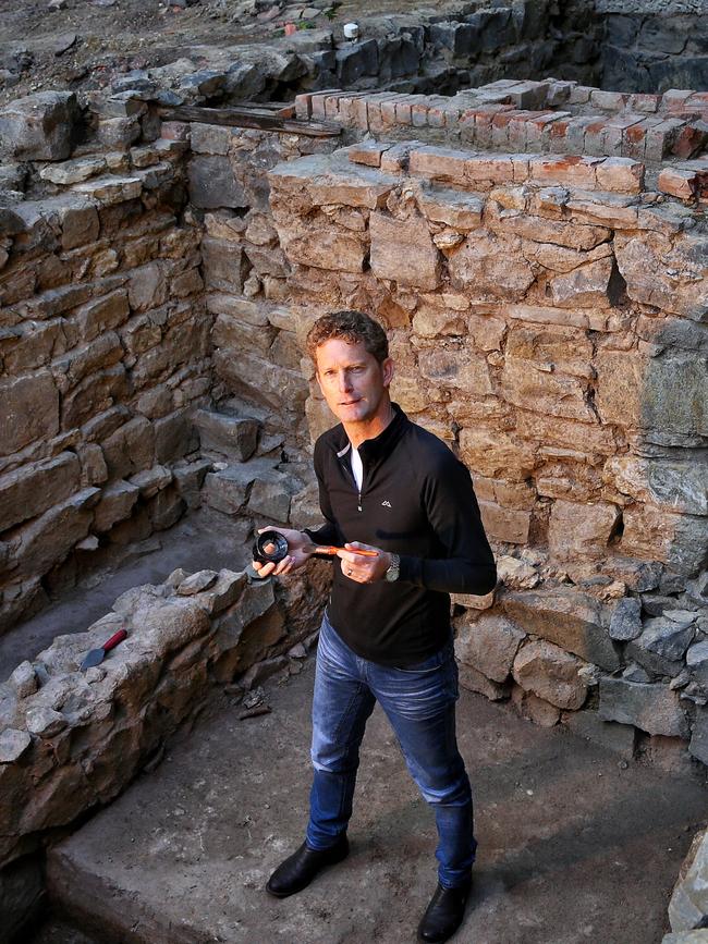 Archaeologist Jeremy Smith at the site of foundations of 1840s built houses unearthed during digging for new development at Wesley Church. Picture: Hamish Blair