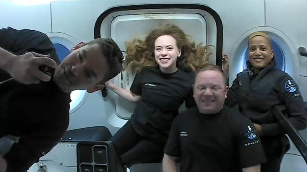 The Inspiration4 space tourists (left to right) Jared Isaacman, Hayley Arceneaux, Christopher Sembroski and Sian Proctor in orbit aboard a SpaceX capsule. Picture: AFP Photo/Courtesy of Inspiration4