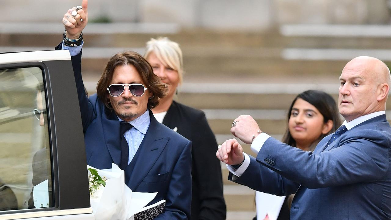 Johnny Depp gestures as he leaves court after the sixth day of his libel trial against News Group Newspapers. Picture: Justin Tallis/AFP